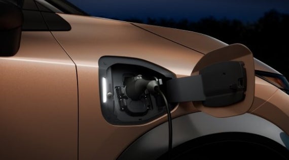 Close-up image of charging cable plugged in | Valley Hi Nissan in Victorville CA