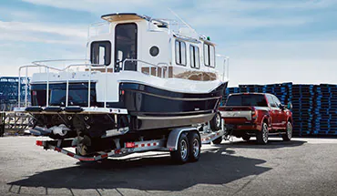 2022 Nissan TITAN Truck towing boat | Valley Hi Nissan in Victorville CA