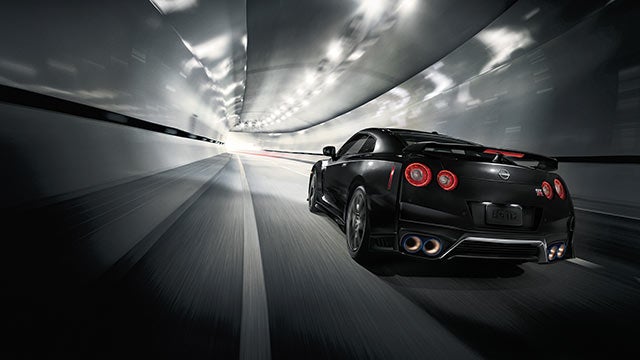 2023 Nissan GT-R seen from behind driving through a tunnel | Valley Hi Nissan in Victorville CA